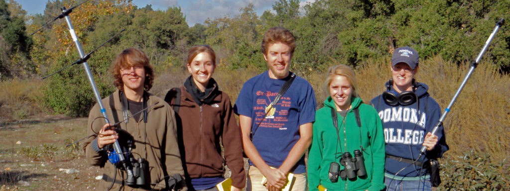 Students with binoculars and radiotrackers
